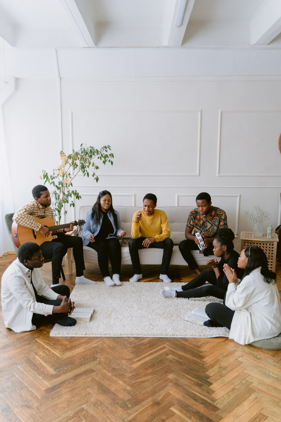 Group of Young People Sitting and Praying